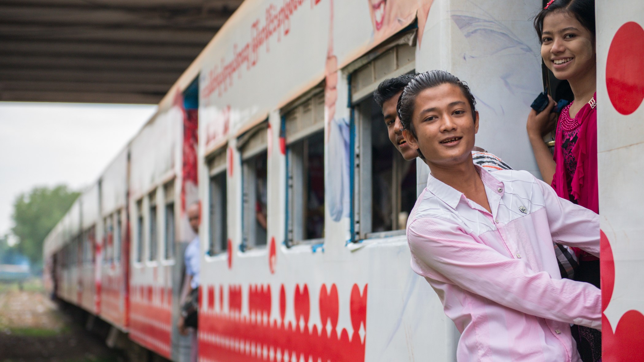 Faces at the Train Door — Myanmar