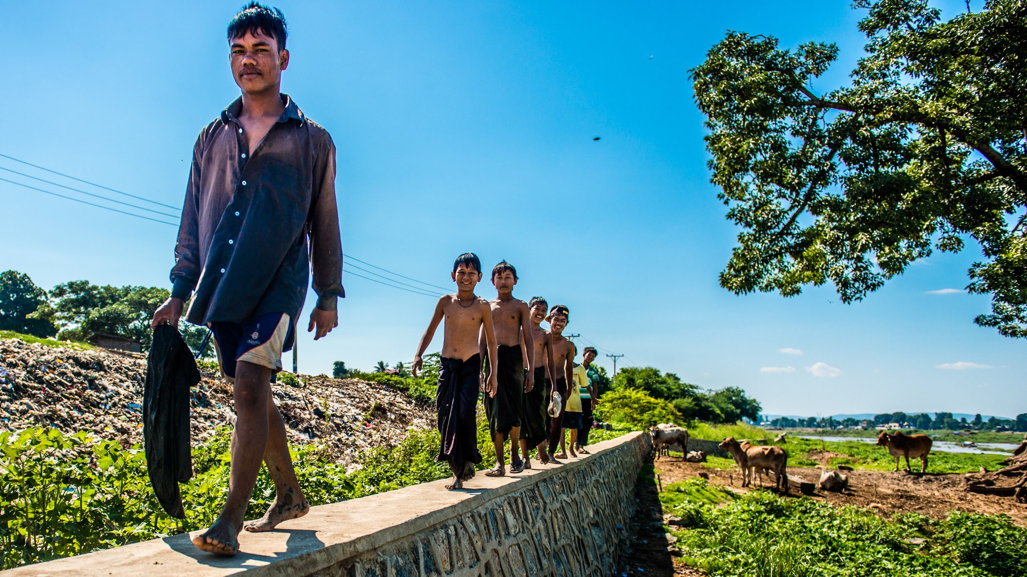Walking Along the River Wall — Myanmar